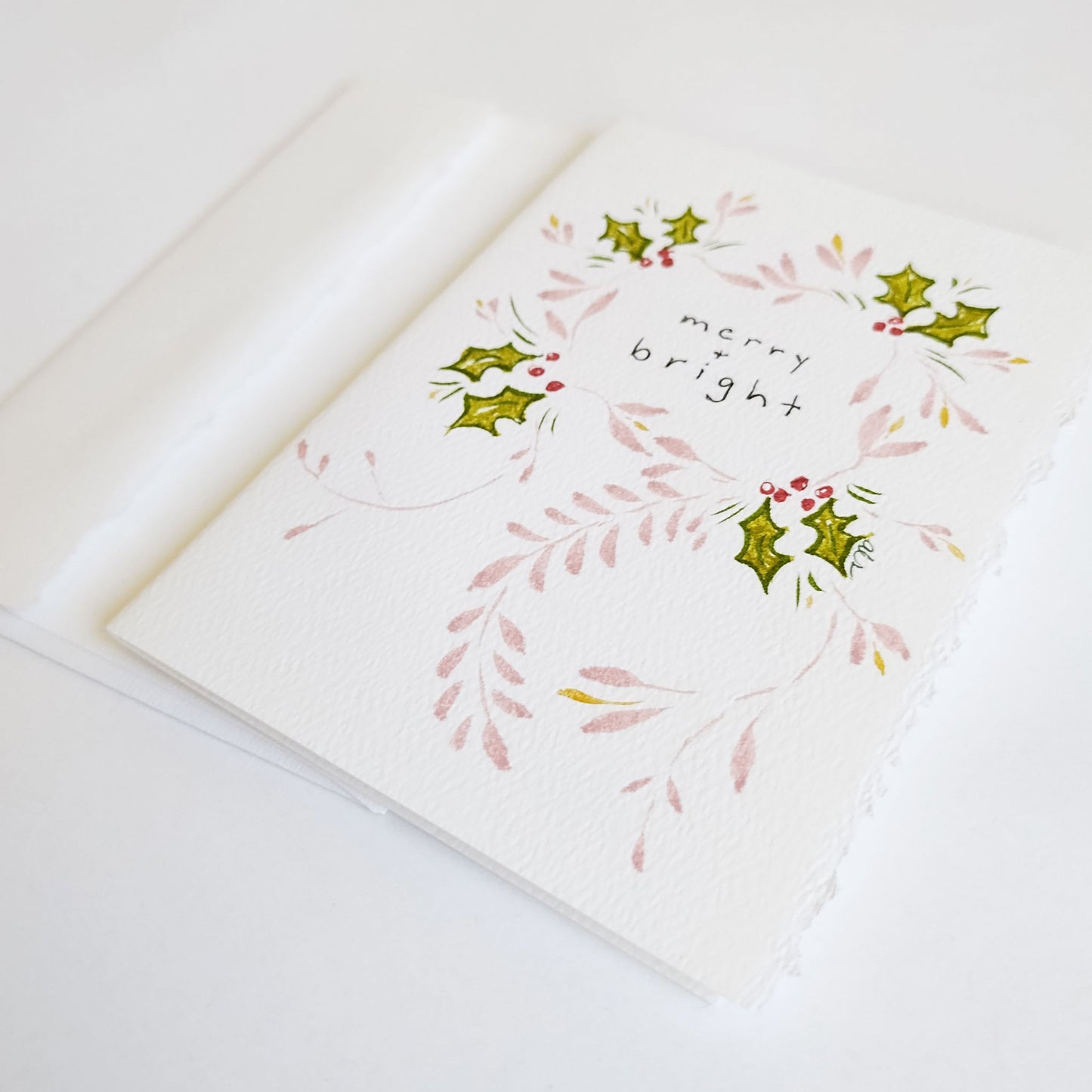 Five Patch Design Merry and Bright Original Holiday Greeting Card with envelope shown at an angle